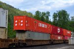 W/B unit stack train through the Taft Road crossing with DTTX 88914 carrying a 53' and 60' containers